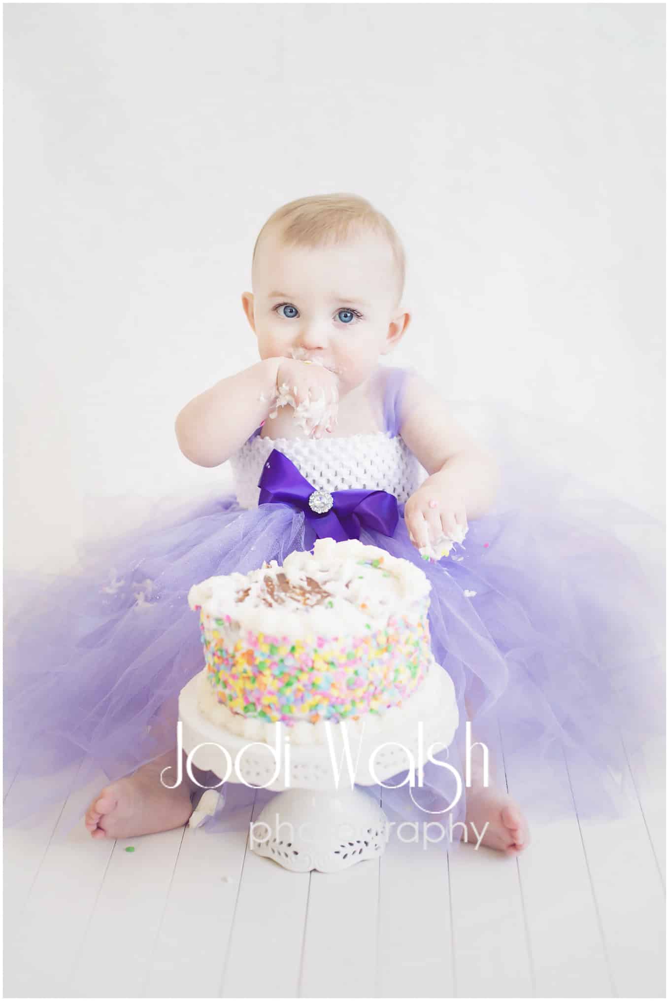 cake smash with purple tutu dress