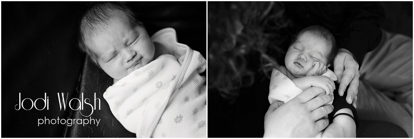 sleeping newborn wrapped in blanket, black and white