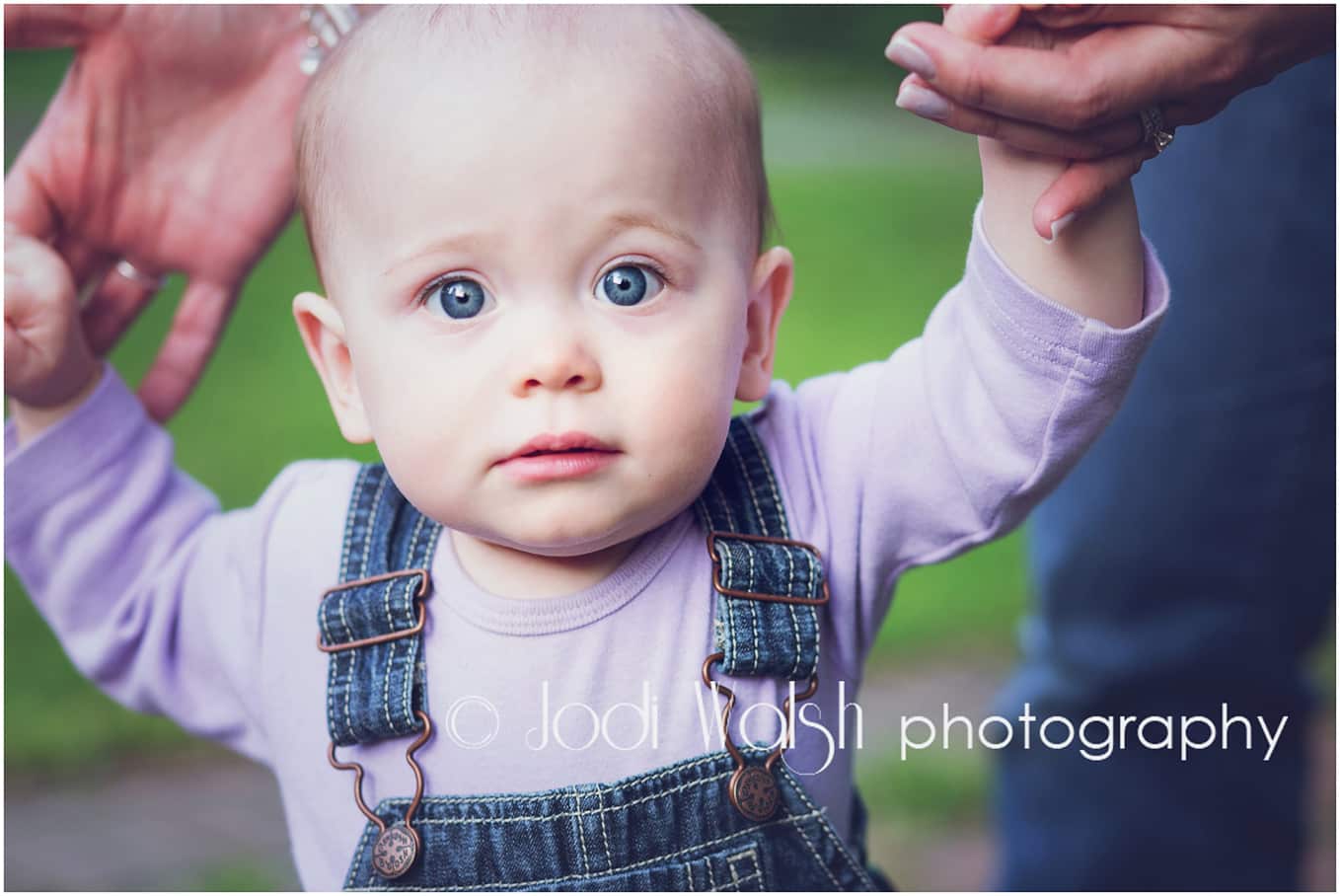 baby girl with big blue eyes holding hands to walk, Pittsburgh baby portrait
