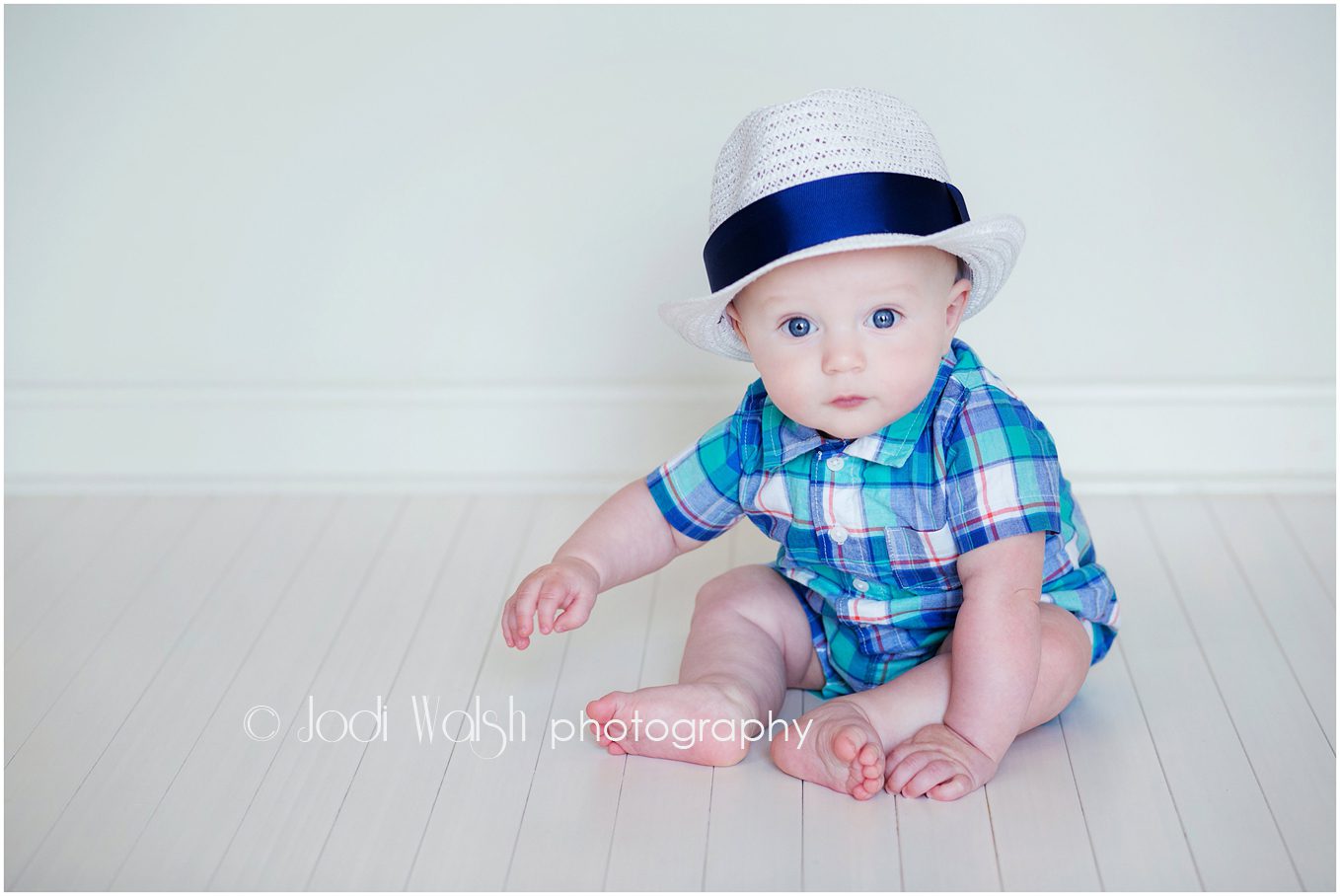baby boy, white brimmed hat, plaid shirt