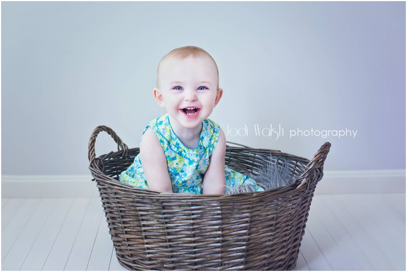 baby girl, blue green dress, basket
