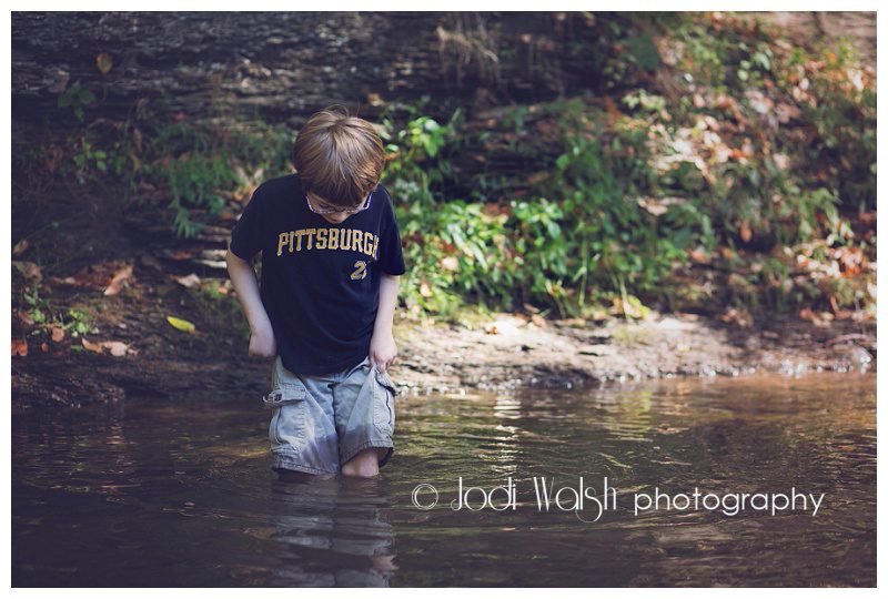 boy wading in Pittsburgh creek