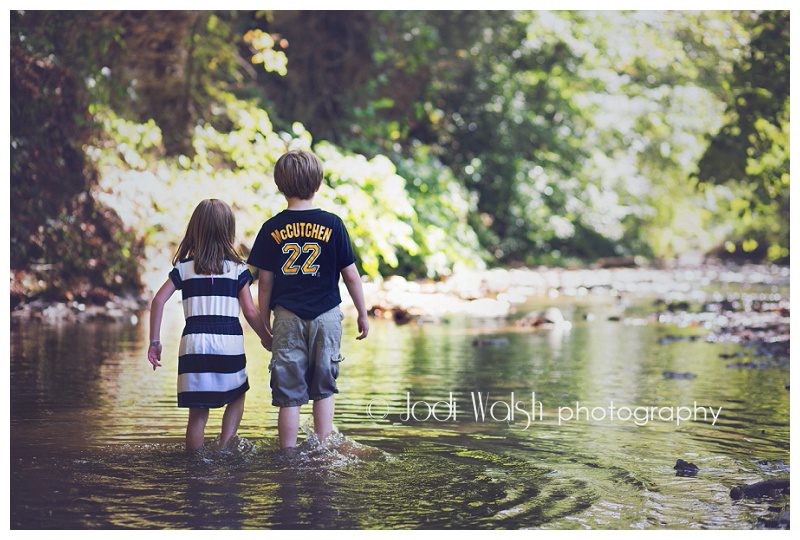 boy and girl walking in a western Pennsylvania creek