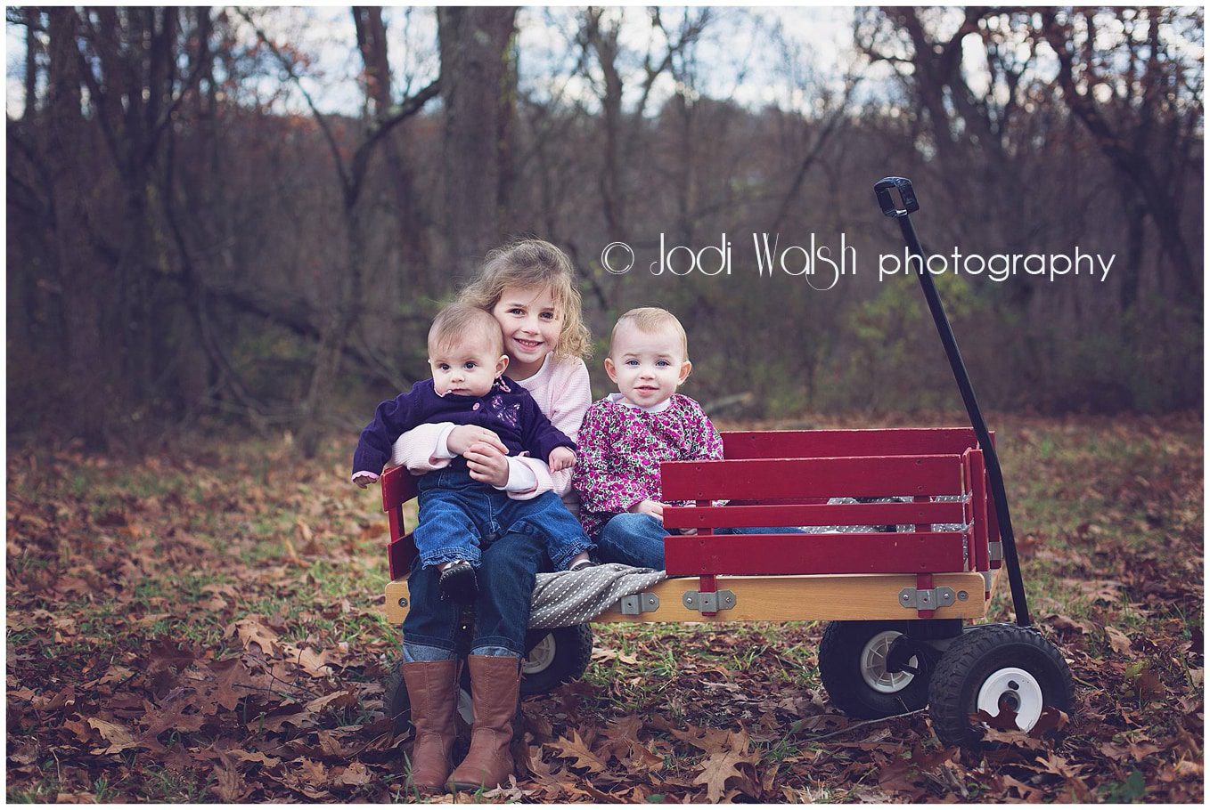 sisters, red wagon, fall leaves