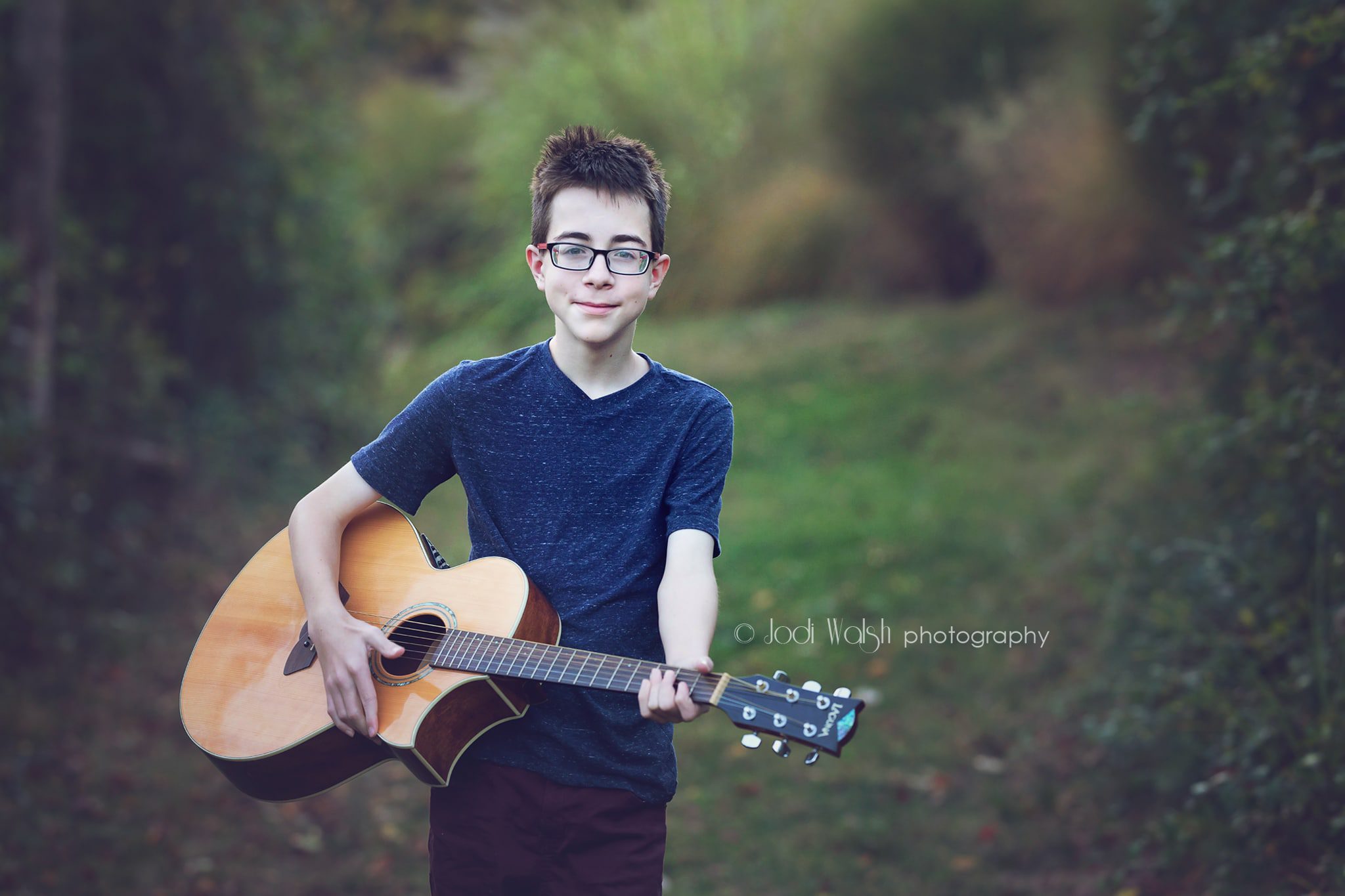 teen boy with acoustic guitar