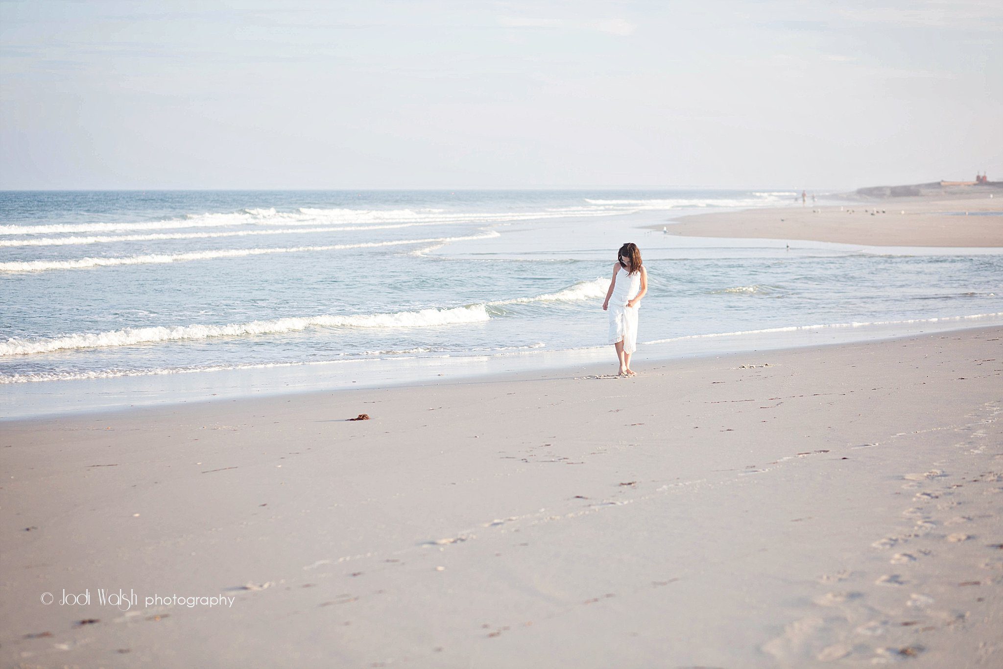 girl in white dress walking on the beach, Long Beach Island New Jersey