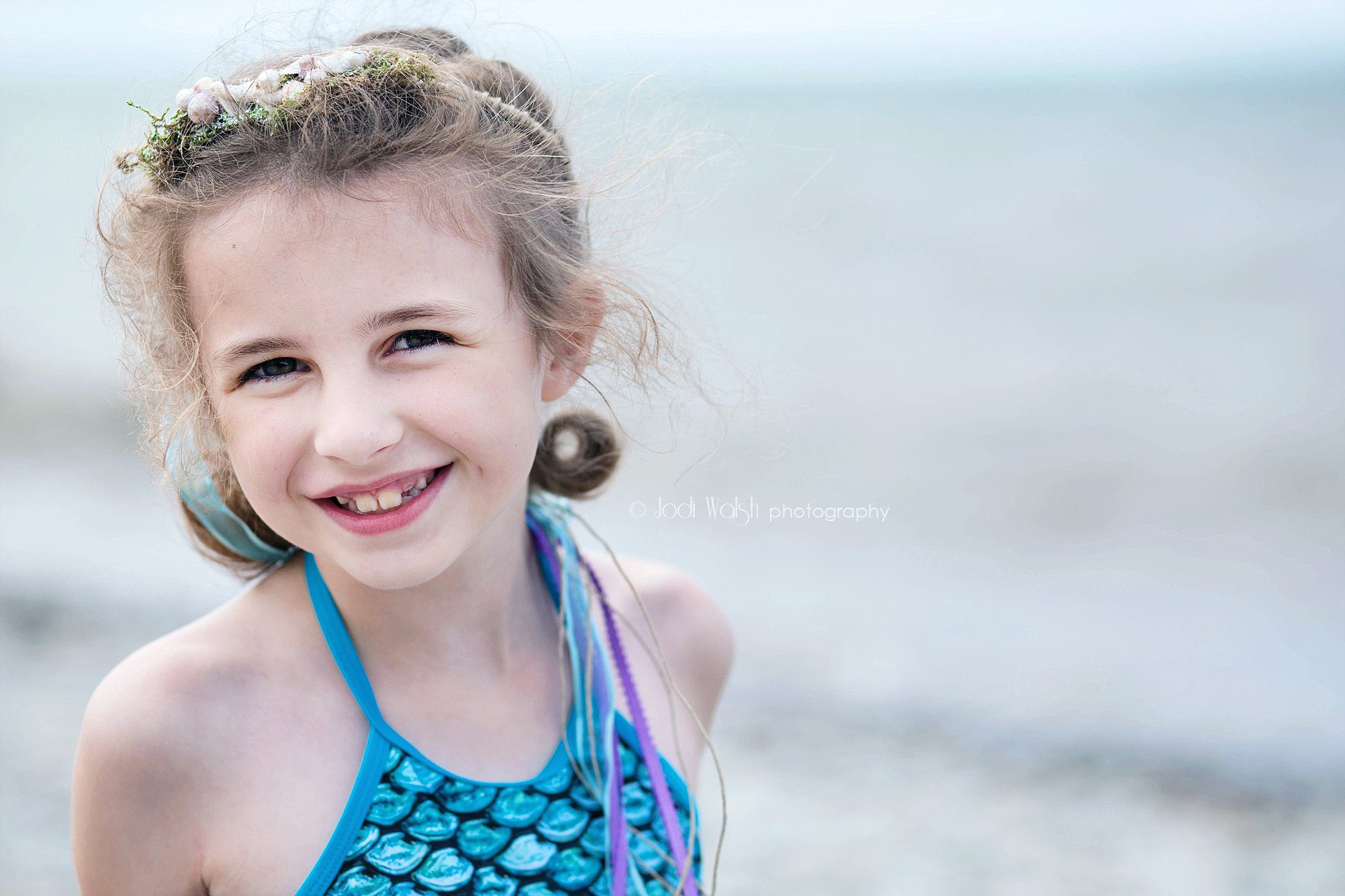 close up of girl with seashell crown at Lake Erie