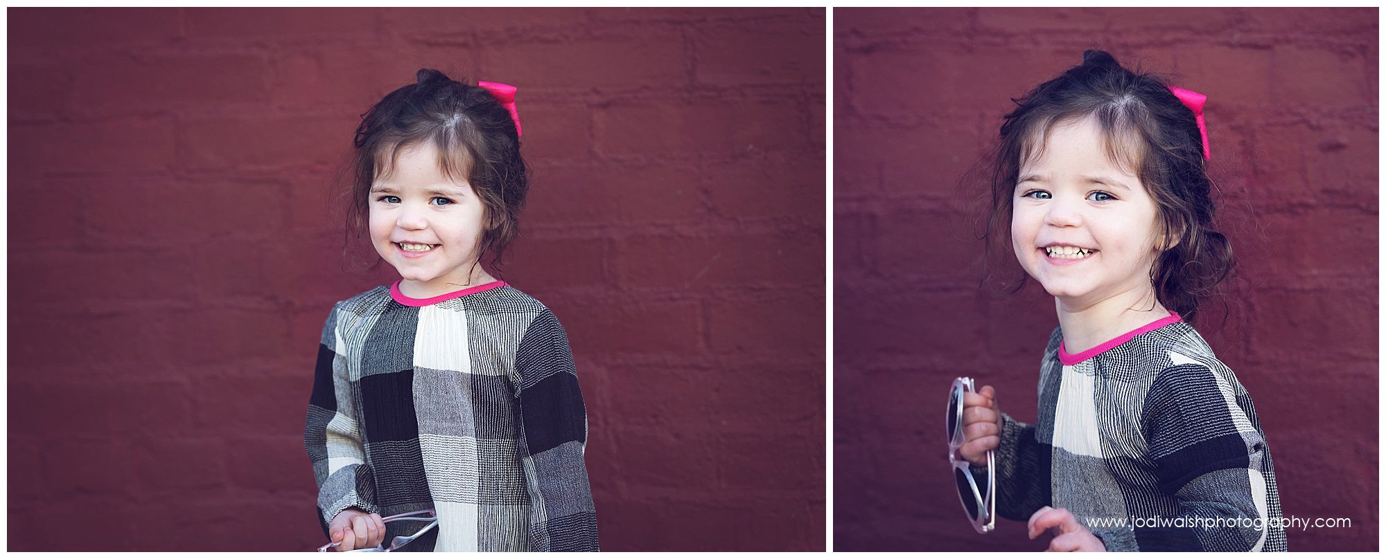 little girl portraits in front of red brick wall