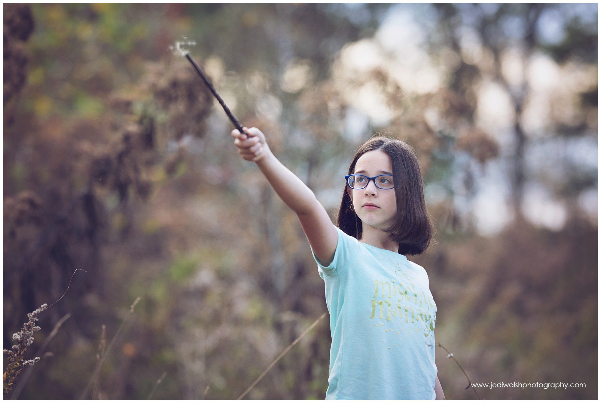 tween girl with Harry Potter wand and sparks