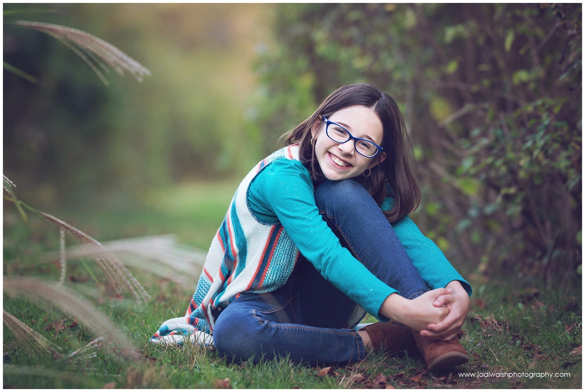 tween girl with glasses in blue