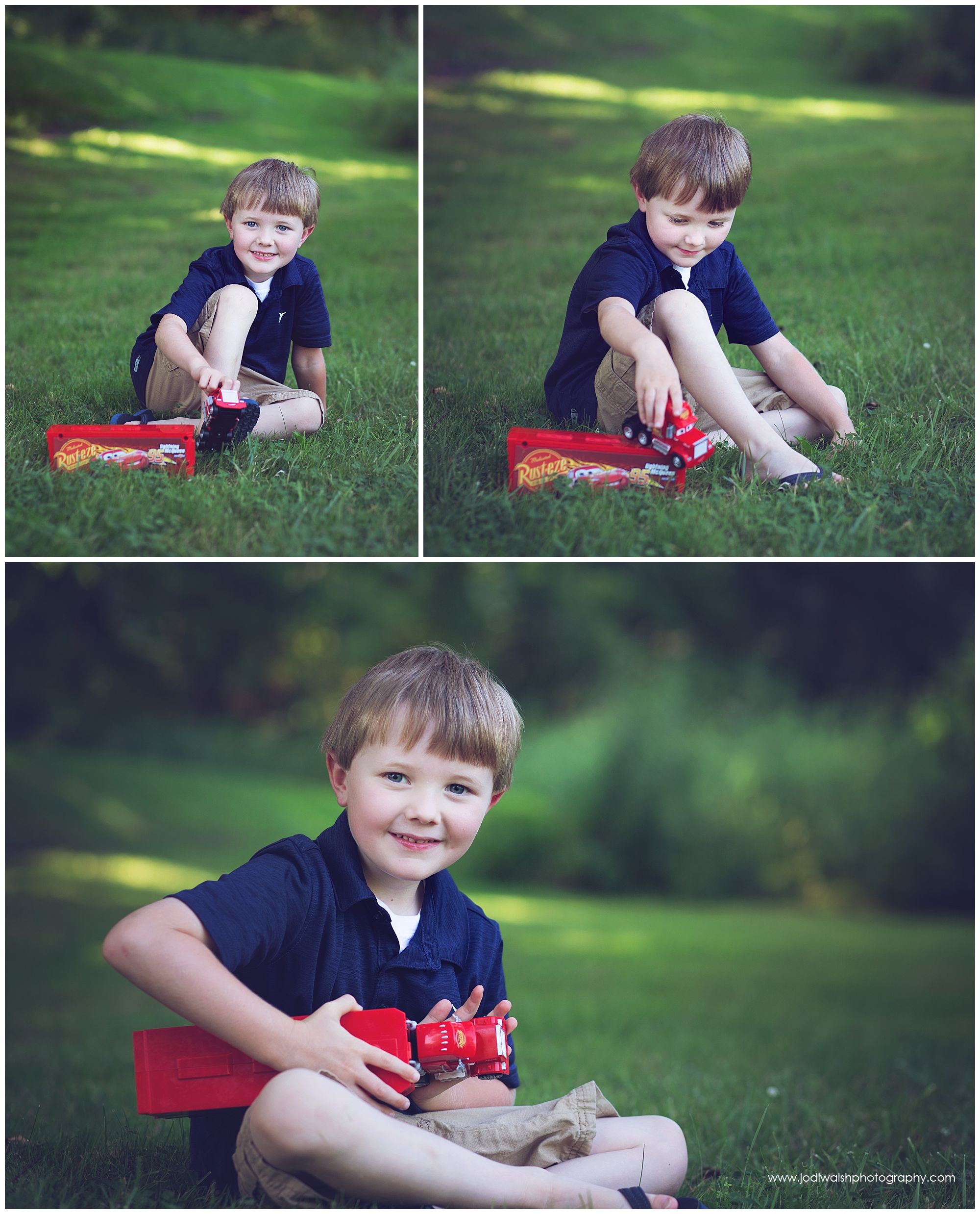 little boy playing in the grass with red toy truck in summer