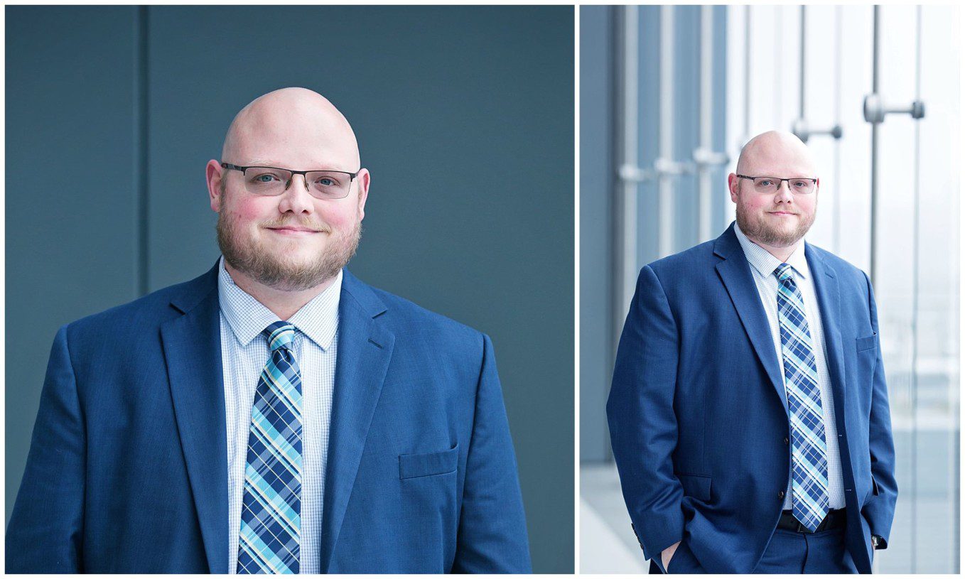 creative headshot of professional man in blue suit with beard and glasses