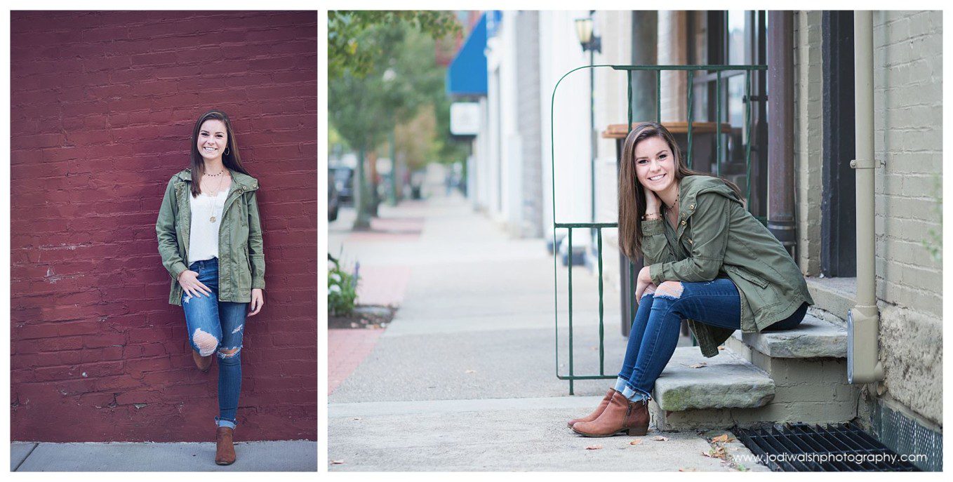 small-town senior portrait session with Jodi Walsh Photography in Sewickley.  images show a senior girl standing against a red brick wall and sitting on a front stoop.  She's wearing a green cargo jacket and ripped jeans.