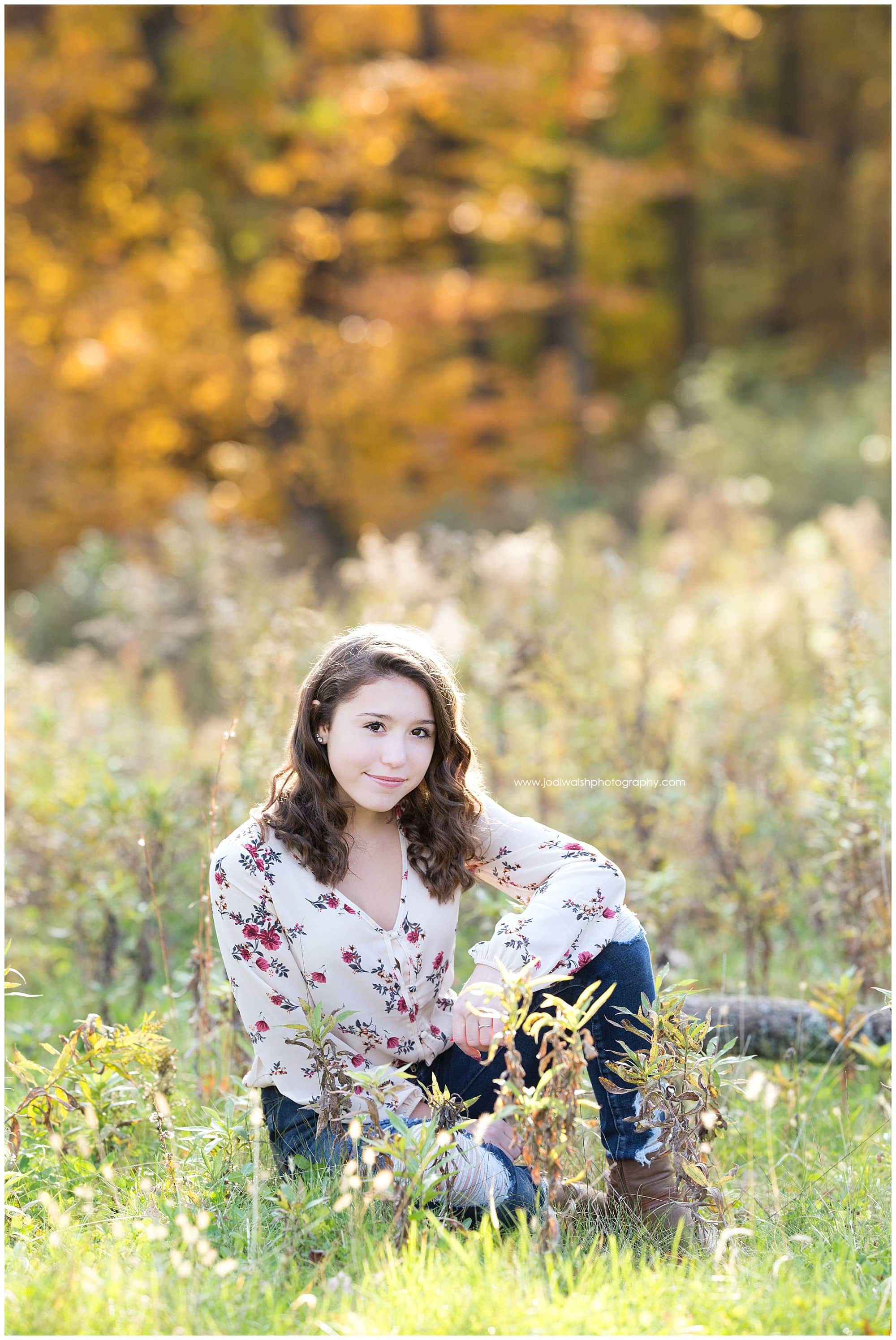 teen girl sitting in fall wildflowers wearing a flowered blouse, Pittsburgh