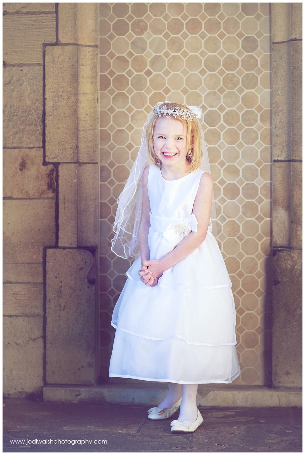 little girl in white dress and veil