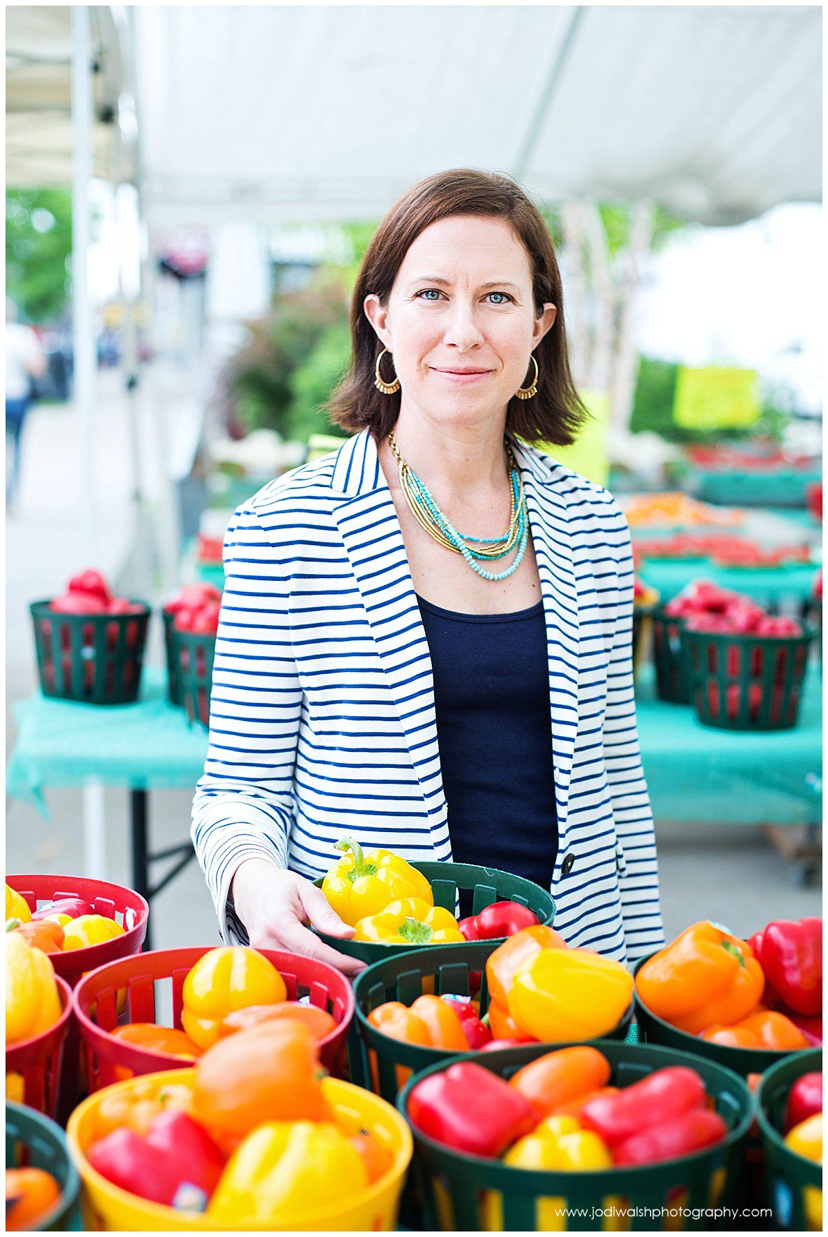 headshots of a woman standing with basket of peppers at farmers market in Pittsburgh