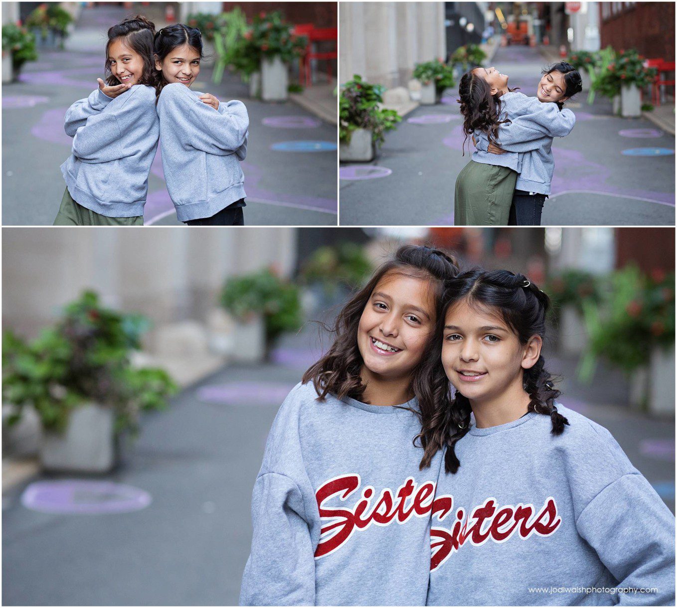images of tween sisters wearing sisters sweatshirts in a Pittsburgh alley.  They both of dark hair and are about the same size.  They're laughing and hugging and smiling at the camera.