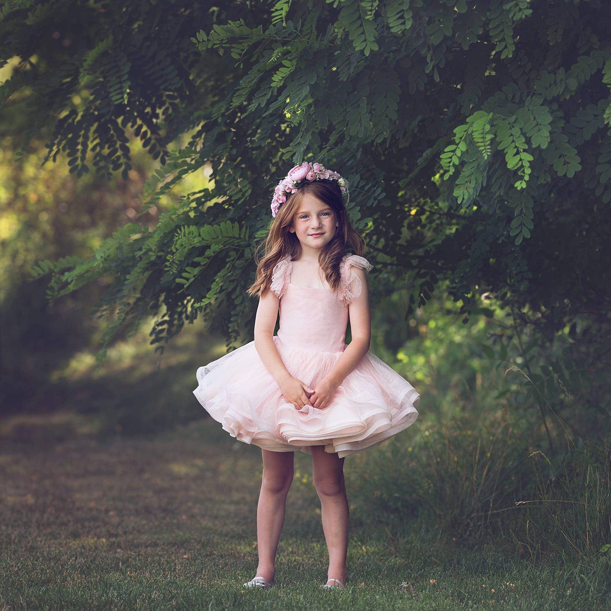 image of a little girl in pink tutu dress and flower crown
