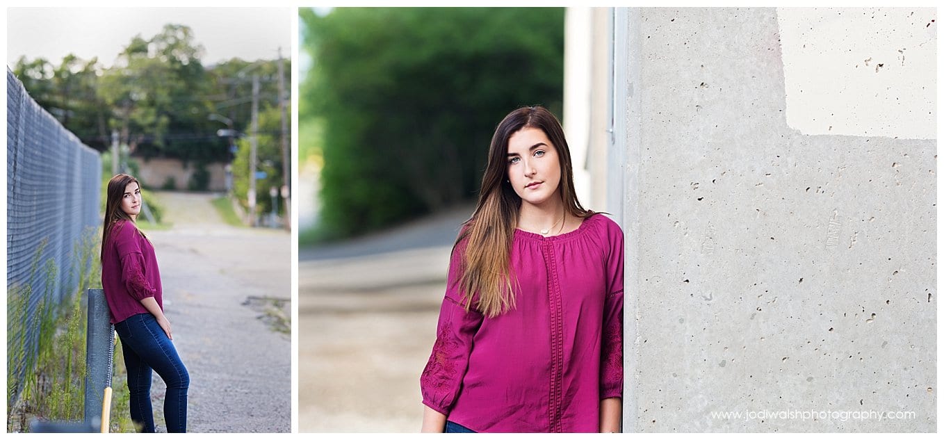 images of senior girl in magenta top and jeans in an alley on the North Side of Pittsburgh