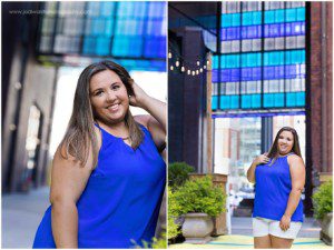 images of a senior girl in a blue top with a bright blue light installation above her. She's smiling as she stands in an outdoor garden in downtown Pittsburgh.