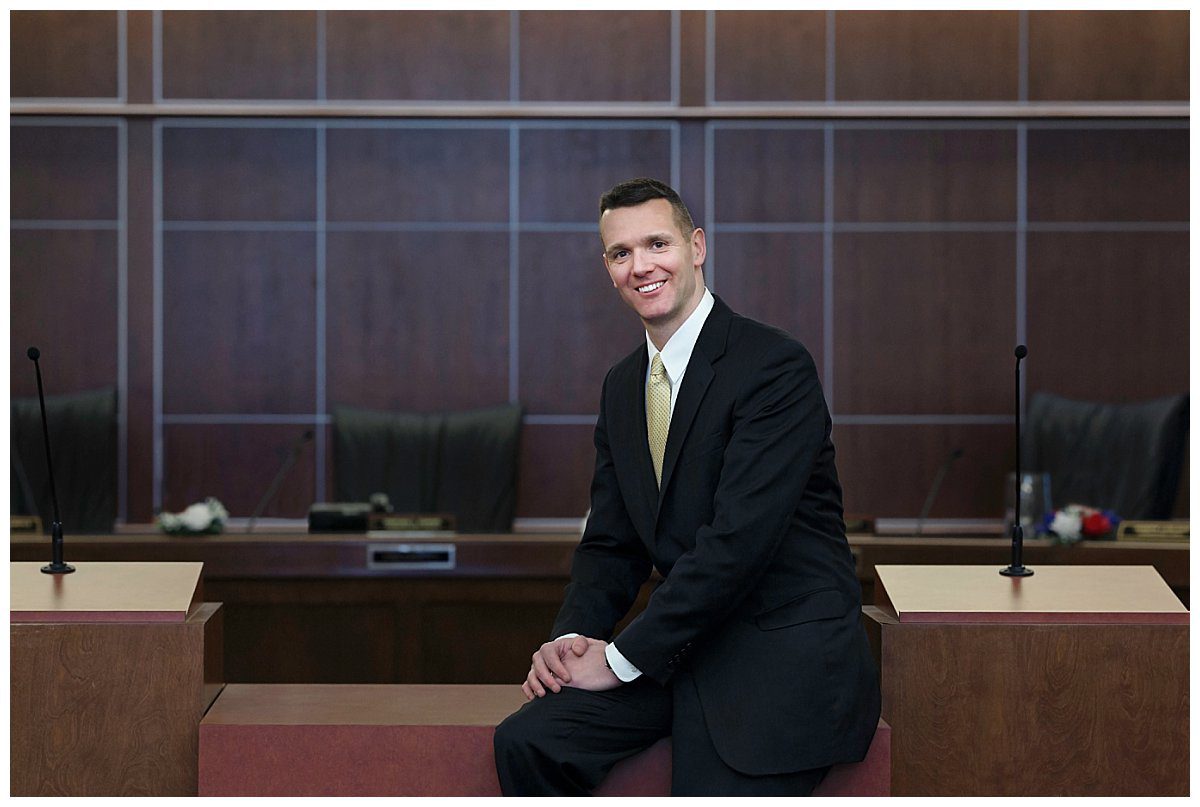 image of Pennsylvania politician, Jeremy Shaffer. He's sitting on a desk in the North Hills community building.