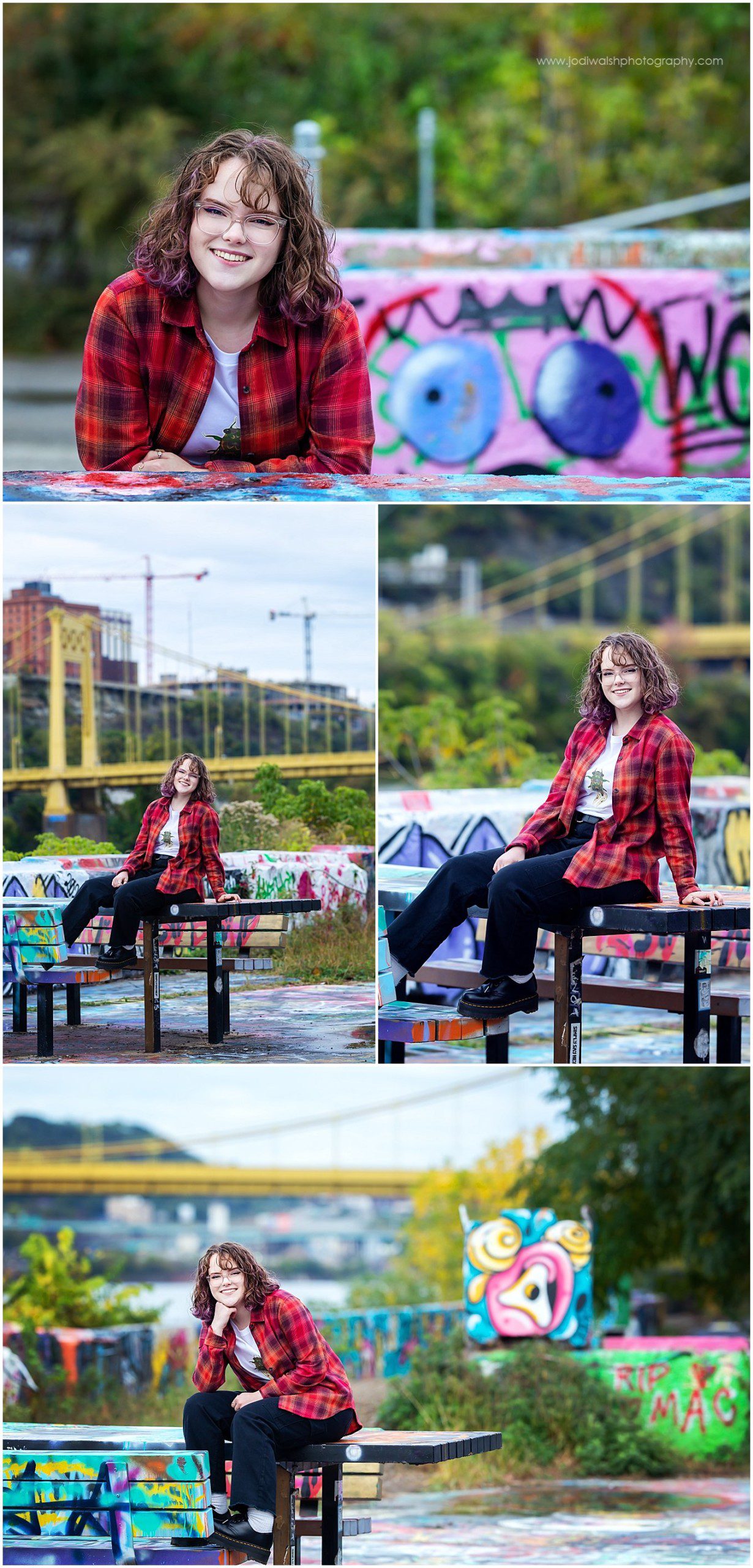 images of a senior girl wearing a red plaid shirt and black jeans. She's sitting on a graffiti colored picnic table at the Color Park in Pittsburgh.